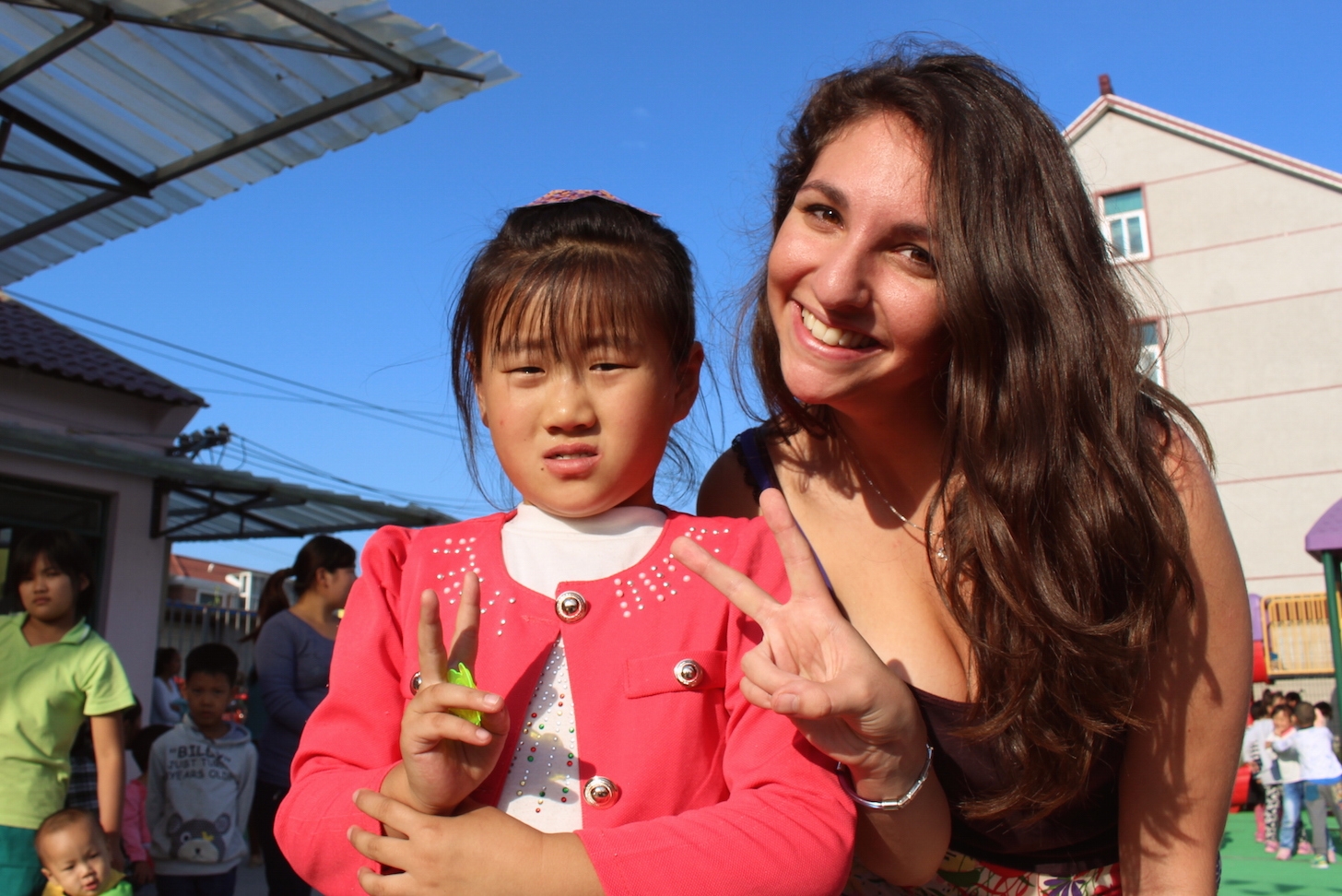 Rebecca poses with a local girl during in internship in Shanghai. "I was definitely the more excited party in this interaction," says Shapiro.