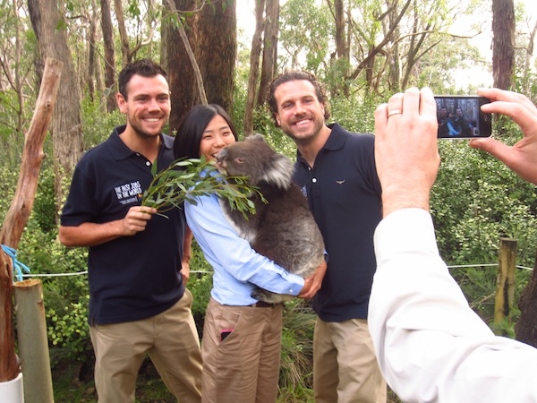 Greg Snell (left) poses with Best Jobs contestants "CC" Hseih and Nick Tilley at the Cleland Wildlife Park in South Australia.