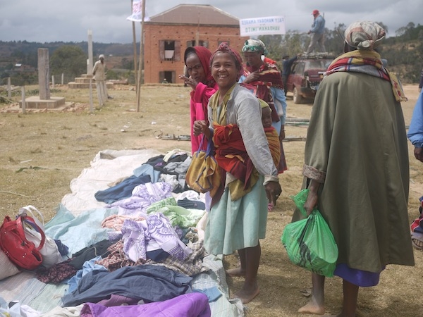 Women in Madagascar inspect the "frip" in a local market.