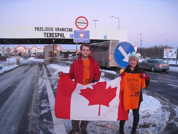 Susan and her travel partner at the Poland-Belarusian border, which they reached in less than 31 hours without spending a dime.