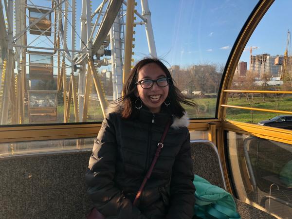 Jillian rides the ferris wheel. 